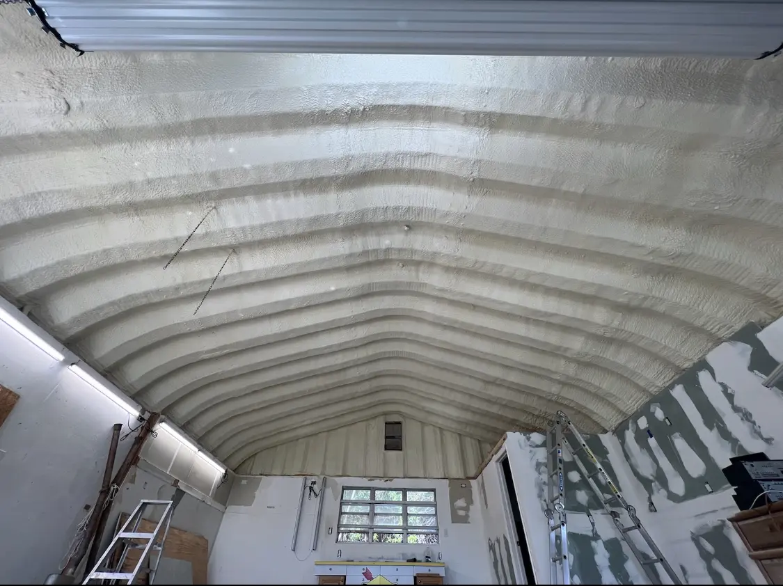 Spray polyurethane foam applied to the underside of a metal roof deck in Richmond Heights